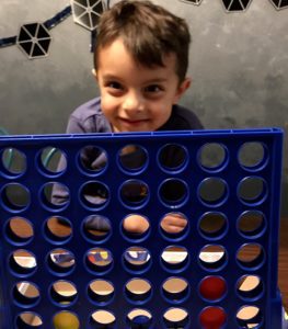 boy plays connect 4, Albuquerque Mom's Blog